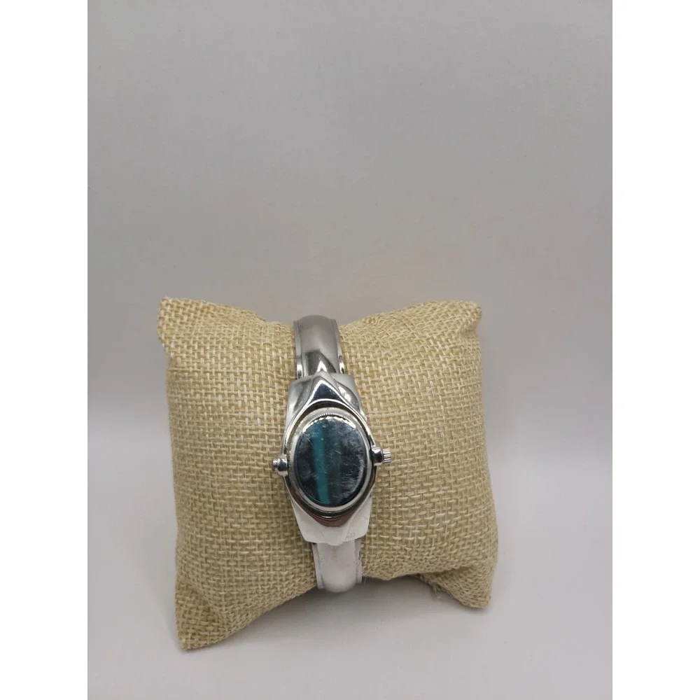 Xanadu Women's Silver Tone Hinged Cuff Bangle Quartz Watch Oval Dial Reverse